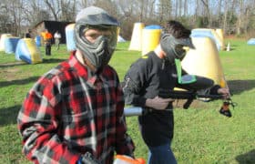men in recovery playing paintball