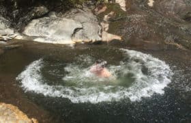 Man swimming in river
