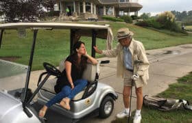 golfer chatting with woman